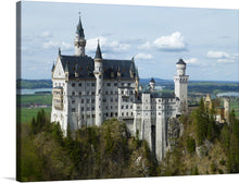  “Neuschwanstein Castle” by Jean Beaufort is a stunning masterpiece that captures the essence of the iconic Bavarian castle nestled amidst lush greenery and rocky terrains. The artwork showcases the castle’s majestic towers and turrets, surrounded by dense forests that accentuate its grandeur.