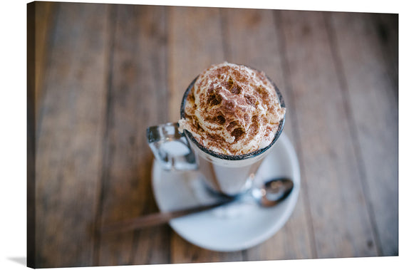 Anete Lusina’s “Drinks” is a stunning photograph that captures the essence of a relaxing evening. The photograph features a coffee press and a mug of hot drink on a table. The photograph is characterized by its warm tones and the use of natural light.