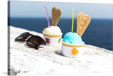  This vibrant artwork features two cups of creamy gelato, each adorned with a playful, smiling wafer stick, resting beside a pair of classic sunglasses against the backdrop of an endless ocean. 