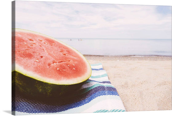 “Half of a Watermelon on the Beach” is a stunning print that captures the essence of summer. The image showcases a ripe watermelon resting on a vibrant beach towel, set against a backdrop of tranquil azure waters meeting the soft sandy shore. 