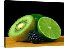  Immerse yourself in the vibrant and refreshing aura of this exquisite print. It captures the essence of nature’s bounty with a meticulously detailed image of a half-sliced kiwi, a half-sliced lime, and a ripe blackberry. The lush green of the kiwi and lime converges with the deep, inviting hue of the blackberry, rendering every texture and color with stunning clarity.