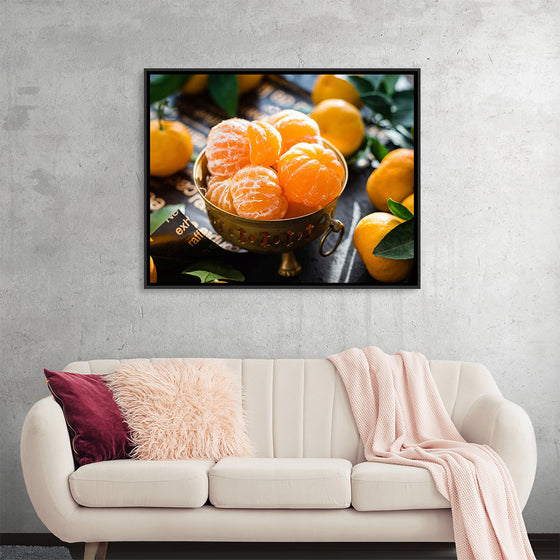 "Oranges in a bowl peeled"