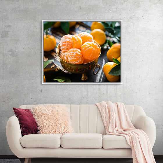 "Oranges in a bowl peeled"