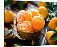  “Oranges in a Bowl Peeled” is a stunning print that captures the essence of nature’s bounty. The artwork features succulent, peeled oranges glistening under the soft touch of sunlight, nestled within an antique brass bowl. The contrast between the gleaming citrus and the dark, rustic undertones of the table sets a scene of harmony and balance.
