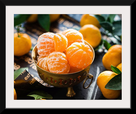 "Oranges in a bowl peeled"