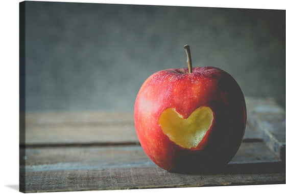 “Apple With a Heart” is a beautiful print that captures the essence of love and nature. The print features a red apple with a heart-shaped bite taken out of it, set against a rustic background. This print would make a great addition to any home or office, bringing a touch of warmth and charm to any space.