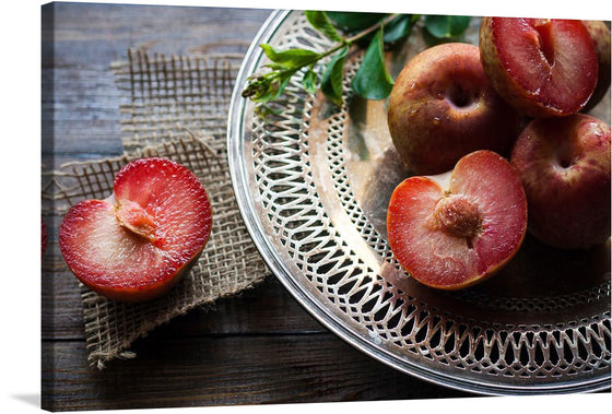 “Close Up of a Cut Open Plum” is an exquisite portrayal of nature’s allure. In this captivating print, the rich crimson flesh of a freshly cut plum takes center stage. The intricate details, from the delicate veins to the glistening droplets, evoke a sense of sumptuousness and freshness. 