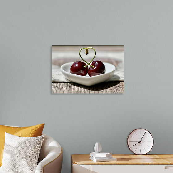 "Pair of cherries in small bowl"