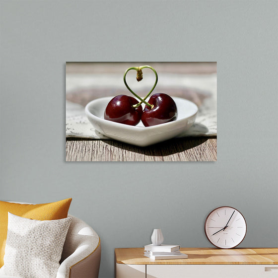 "Pair of cherries in small bowl"