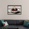 "Pair of cherries in small bowl"