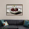 "Pair of cherries in small bowl"