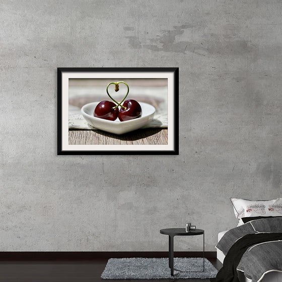 "Pair of cherries in small bowl"