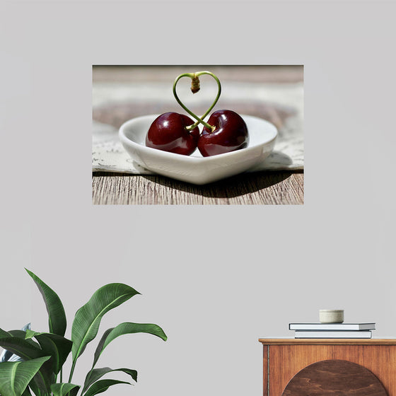 "Pair of cherries in small bowl"