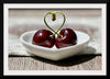 "Pair of cherries in small bowl"