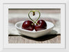 "Pair of cherries in small bowl"