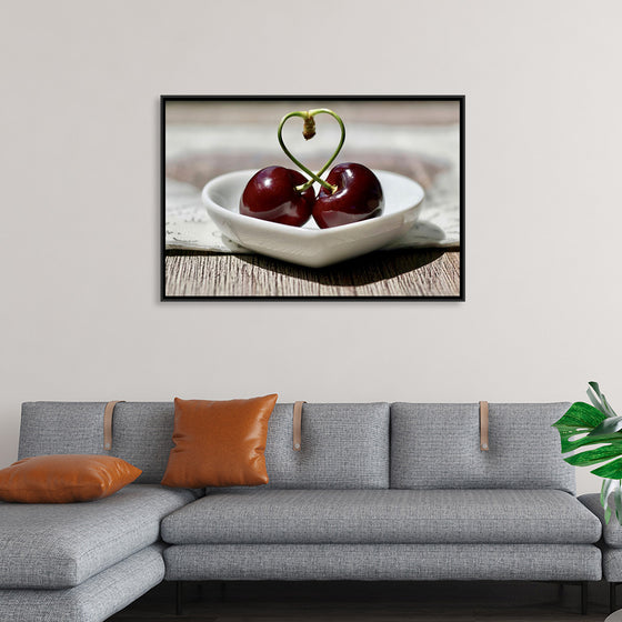 "Pair of cherries in small bowl"