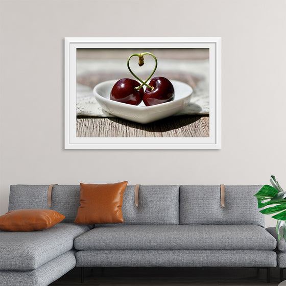 "Pair of cherries in small bowl"