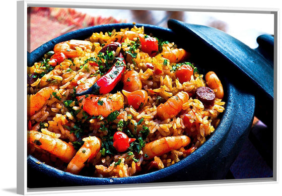 "Pot of Spanish paella with shrimp, rice, sausage, and peppers for dinner"