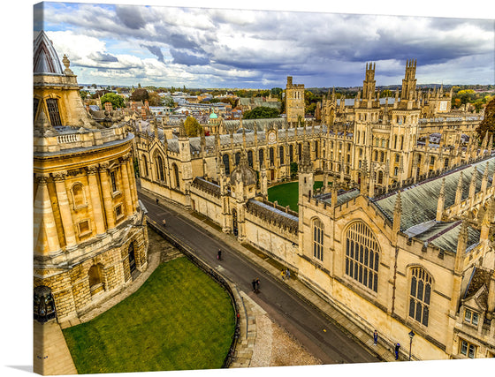 “Oxford, UK” is a breathtaking print that captures the essence of this historic city. The image showcases Oxford’s iconic architecture under a partly cloudy sky. The scene is dominated by prominent historical buildings with intricate designs and towering spires. The stone structures exhibit various shades of beige, accentuated by shadows and sunlight.