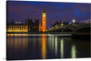 “Westminster Palace And Big Ben”: This mesmerizing aerial view of Westminster Palace and Big Ben against the backdrop of the Thames River in London is a visual symphony. The iconic clock tower, officially known as the Elizabeth Tower, stands tall, its intricate details etched in time. 