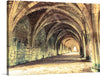 This evocative photograph captures the stark beauty of a long stone tunnel with arched ceilings. The tunnel stretches into the distance, its smooth curves and rough-hewn stones creating a sense of mystery and intrigue. Faint lines of mortar snake between the stones, hinting at the immense labor that went into its creation.