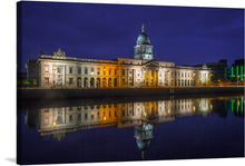  This atmospheric print captures the grandeur of the Custom House in Dublin, Ireland. The iconic building, bathed in the warm glow of lights, a reflection on River Liffey. The gentle curves of the building's dome and the intricate details of its facade are softened by the hazy twilight, creating an air of mystery and intrigue.