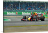 Capture the exhilarating speed and precision of Formula 1 racing with this stunning print! Every detail, from the sleek design of the race car adorned in vibrant colors to the blurred background capturing its rapid motion, brings the thrill of the race into your space. The distant spectators and prominent Heineken® advertisements immerse you in a world where engineering and adrenaline coalesce. 