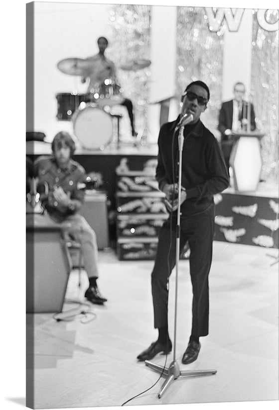 “Stevie Wonder” by Jack de Nijs for Anefo captures a timeless moment, where music and emotion intertwine, echoing the legendary artistry of one of music’s greatest icons. The blurred background accentuates the focus on Stevie, encapsulating his enigmatic aura.