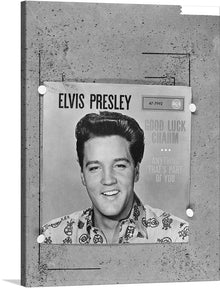  This stunning black and white print of Elvis Presley is a must-have for any fan of the King of Rock and Roll. The print captures Elvis in all his glory, with his iconic pompadour and dazzling smile. The words "Good Luck Charm" and "Anything That's Part of You" are next to Elvis's head.