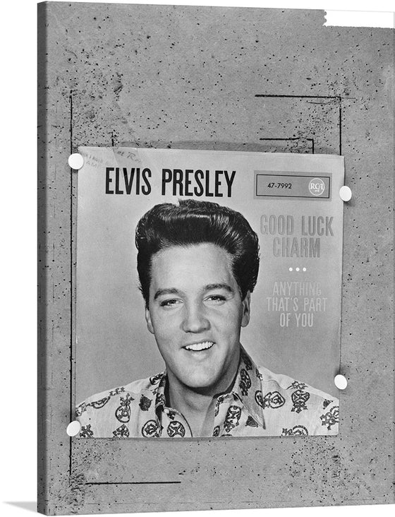 This stunning black and white print of Elvis Presley is a must-have for any fan of the King of Rock and Roll. The print captures Elvis in all his glory, with his iconic pompadour and dazzling smile. The words "Good Luck Charm" and "Anything That's Part of You" are next to Elvis's head.