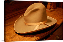  “Stetson Cowboy Hat 1950” by oo0(GoldTrader)0oo- captures the essence of rugged individualism and timeless style. This exquisite print showcases the iconic silhouette of a classic Stetson, evoking the indomitable spirit of the American West. The rich, warm tones and meticulous detail bring this piece to life, making it a perfect addition for collectors and enthusiasts alike. 