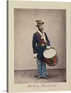 This print of an Artillery Musician is a unique and engaging piece of art. The colors are vibrant and the subject is interesting. This print would make a great addition to any collection. The print is a photo-realistic image of an Artillery Musician wearing a blue uniform with red trim and a tall hat with a feather, holding a drum and drumsticks.