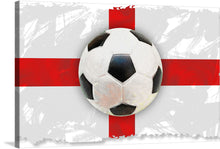  This stunning print of a soccer ball sitting on top of the English flag is a must-have for any fan of English football or art. The soccer ball is black and white, and it has a red cross on it. The flag of England is red and white, and it has a white cross on it.