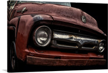  “The 1956 Ford F-100” is a stunning piece of art that captures the essence of the classic American truck. The print showcases the front of the truck, with its iconic grille and headlight design. The rusted and weathered look of the truck adds to its vintage charm. 