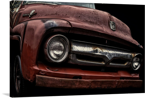 “The 1956 Ford F-100” is a stunning piece of art that captures the essence of the classic American truck. The print showcases the front of the truck, with its iconic grille and headlight design. The rusted and weathered look of the truck adds to its vintage charm. 