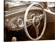  Step back in time with this exquisite print capturing the intricate details of a vintage car’s interior. Every curve, dial, and detail is rendered with stunning clarity, inviting viewers to imagine a leisurely drive along scenic routes of yesteryears. The sepia tone adds an element of nostalgia, making this artwork not just a piece to adorn your walls but a journey to an era where every ride was an experience and every turn of the wheel, a cherished memory.