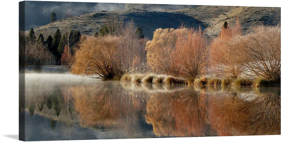 Wairepo Arm Twizel.NZ” with me. This print captures the serene beauty of Wairepo Arm in Twizel, New Zealand. The artwork depicts a tranquil morning with the sun’s golden hues kissing the autumnal foliage, casting an ethereal glow that dances on the placid waters below. 