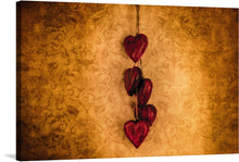  Immerse yourself in the warm, romantic allure of this exquisite artwork, now available as a premium print. Five richly hued, wooden hearts dangle gracefully against an opulent backdrop adorned with intricate patterns. Each heart, painted in a luscious shade of red and accentuated by the soft, ambient lighting, tells a silent tale of love and connection.