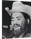 Bring the iconic Willie Nelson into your space with this black and white publicity portrait for Atlantic Records.  This stunning print captures Nelson in his classic cowboy hat, with his piercing gaze and confident expression. 