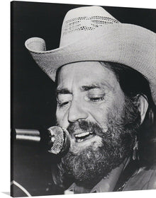  Bring the iconic Willie Nelson into your space with this black and white publicity portrait for Atlantic Records.  This stunning print captures Nelson in his classic cowboy hat, with his piercing gaze and confident expression. 