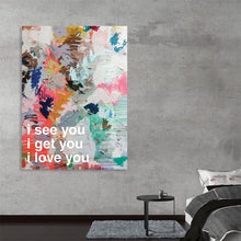  “iloveyou” by Kent Youngstrom is a captivating abstract print that effortlessly marries the chaos of color with the serenity of sentiment. The pastel hues of pink, blue, and yellow dance across the canvas in bold brushstrokes, creating a backdrop for the heartfelt message at its core: “i see you, i get you, i love you”.