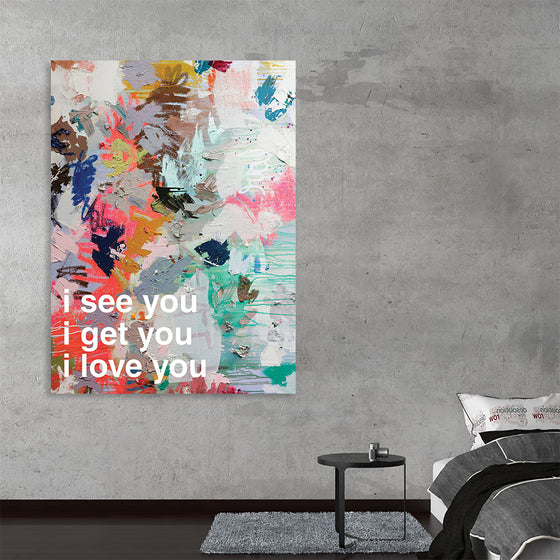 “iloveyou” by Kent Youngstrom is a captivating abstract print that effortlessly marries the chaos of color with the serenity of sentiment. The pastel hues of pink, blue, and yellow dance across the canvas in bold brushstrokes, creating a backdrop for the heartfelt message at its core: “i see you, i get you, i love you”.