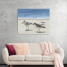  Adorn your space with the serene beauty encapsulated in this exquisite print, where the delicate dance of three sandpipers is immortalized against a backdrop of a tranquil beach and gentle waves. 