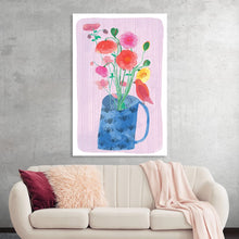  “Bright Poppies in Vase” by Fiona Solley is a captivating artwork that breathes life and vibrancy into any space. The print, characterized by its bold and lively poppies, set against a serene pink backdrop, encapsulates the essence of spring and renewal. Each flower is rendered with meticulous detail, showcasing a harmonious blend of warm hues that dance elegantly off the canvas. The blue vase adorned with subtle leaf motifs anchors the composition, adding depth and contrast. 