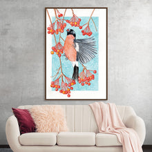  “Bullfinch Snacktime” by Girija Kulkarni invites you into a world of enchantment. This exquisite print captures a majestic bullfinch mid-flight, its vibrant plumage a symphony of reds and blacks against an icy blue backdrop. The branches, laden with crimson berries, curve gracefully, evoking winter’s silent beauty. 