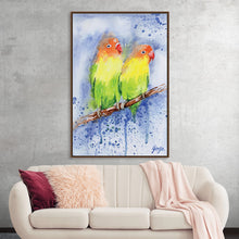  Lovebirds by Girija Kulkarni is a vibrant watercolor painting that captures the tenderness and affection between two small birds. The birds, painted in shades of green, yellow, and orange, are perched side by side on a branch, their beaks touching. The artist's skillful use of color and light creates a sense of warmth and intimacy, while the delicate details of the birds' feathers and the surrounding landscape add to the overall charm of the piece. 