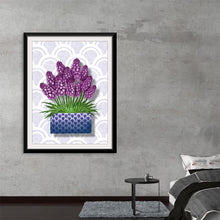  This exquisite art print, featuring vibrant clusters of lavender blooms rising gracefully from a stylish patterned planter, is a visual treat. Each petal, meticulously crafted, seems to pulse with life against the elegant backdrop of intricate designs. The lush green leaves at the base provide a contrasting color that enhances the visual appeal.