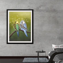  Immerse yourself in the serene beauty of “Budgie Siesta 2021,” a captivating print showcasing two exquisite budgies perched upon a slender branch. Their feathers, a mesmerizing dance of colors, blend harmoniously against a soft, ethereal background, evoking a sense of tranquil elegance. 