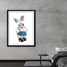  “Ava In Her Quackverall” invites you to a whimsical world where innocence and imagination intertwine. This captivating print features Ava, adorned in playful duck-themed overalls with bunny ears peeking out. Each brushstroke tells a story of exploration and joy, making this artwork not just visually delightful but emotionally evocative. 