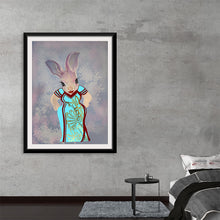  Dive into the whimsical world of Ava Leopold with “Ava Qipao with Background,” a captivating artwork that marries traditional elegance and playful imagination. In this piece, a graceful rabbit adorned in a vibrant Qipao dress stands against an ethereal backdrop, inviting viewers into a narrative woven with cultural richness and fantastical allure. 